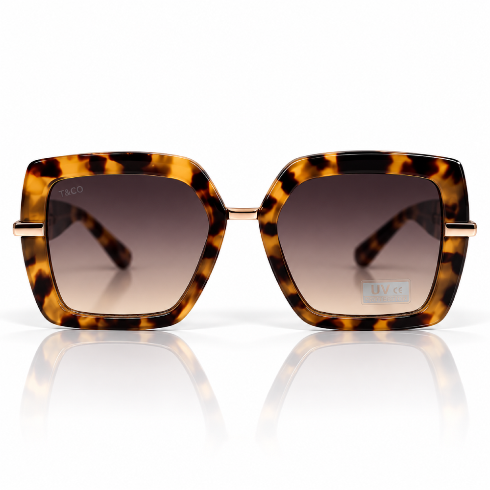 Carey ámbar y marrón oscuro · lentes gris marrón degradado · detalles dorados