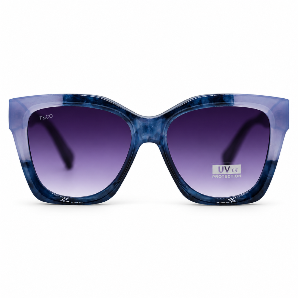 Azul translúcido / azul petróleo · lentes gris degradado · montura oversize estilo ojo de gato