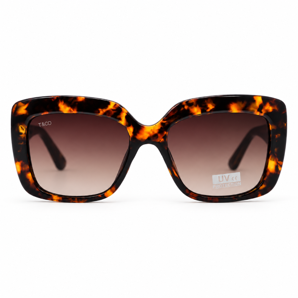 Carey ámbar y negro · lentes marrón degradado · montura cuadrada oversize
