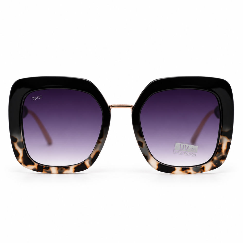 Negro brillante y carey crema en la parte inferior · puente dorado · lentes gris degradado · montura cuadrada oversize
